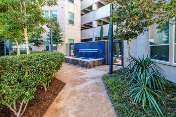 Private courtyard with water feature and activities lawn