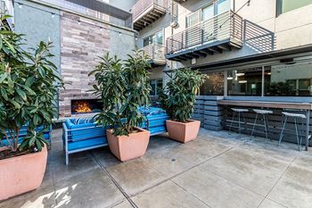 Trellised outdoor dining and grilling areas