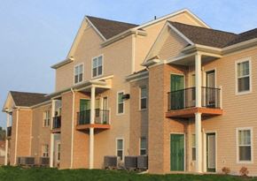Kokomo townhouse for rent - a row of brick apartment buildings with balconies