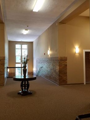 Logansport apartment for rent - an empty living room with a table and a window