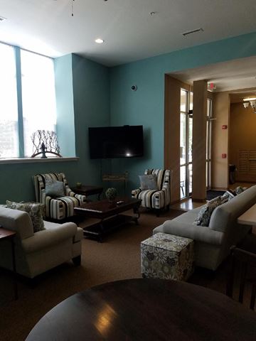 Logansport apartment for rent - a living room with couches and chairs and a television