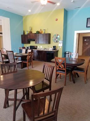 Logansport apartment for rent - a dining room and kitchen with a table and chairs