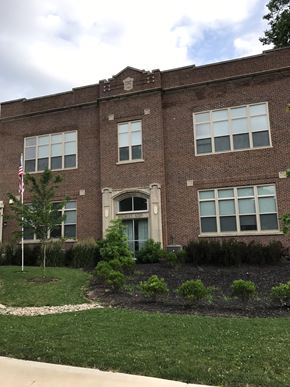 Logansport apartment for rent - the front of a brick building with a lawn