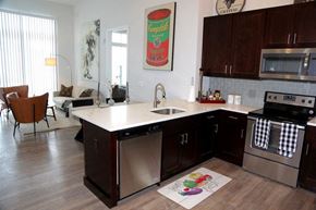 Metuchen apartment for rent - a kitchen with stainless steel appliances and a white counter top