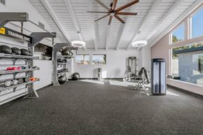 Santa Ana townhouse for rent - the gym has plenty of equipment and a large window