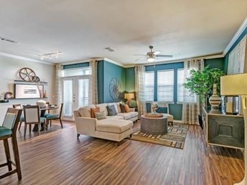 Irving apartment for rent - A living room with a white couch and a wooden floor.