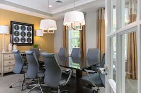 Pasadena townhouse for rent - a conference room with a glass table and chairs