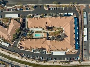 Henderson apartment for rent - an aerial view of a building with a parking lot