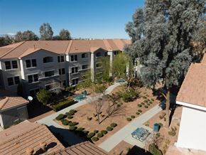 Henderson apartment for rent - an aerial view of an apartment complex with a pool and trees