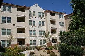 Las Vegas apartment for rent - an apartment building with a courtyard in front of it