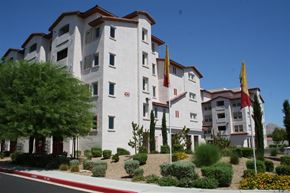 Las Vegas apartment for rent - a large white building with flags in front of it