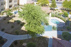 Las Vegas apartment for rent - an aerial view of a park with a pool and trees