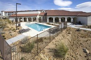 Las Vegas apartment for rent - a pool and a house with a fence