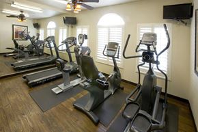 Las Vegas apartment for rent - a group of exercise equipment in a gym