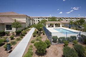 Las Vegas apartment for rent - an aerial view of a yard with a pool and buildings