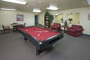 Henderson apartment for rent - a red and black pool table in a room
