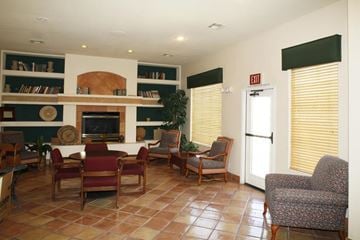 Las Vegas apartment for rent - a living room with a table and chairs and a fireplace