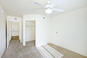 Henderson apartment for rent - an empty living room with a ceiling fan