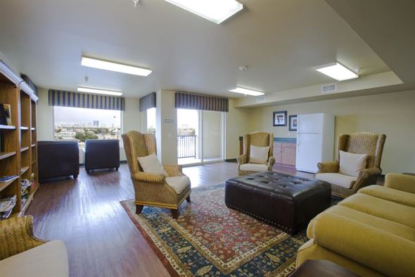 Las Vegas apartment for rent - a living room with a couch and chairs and a rug