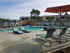 San Diego apartment for rent - Outdoor pool area with lounge chairs at Mission Trails Apartments San Diego, California