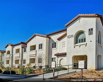 Las Vegas apartment for rent - a large building with a sign in front of it