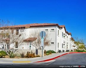 Las Vegas apartment for rent - a white building with a stop sign in front of it