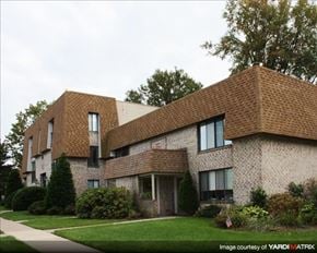 Dublin apartment for rent - A modern house with a brown roof and a well-maintained lawn.