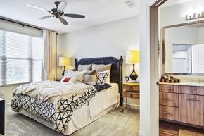 Brookhaven apartment for rent - a bedroom with a bed and a ceiling fan
