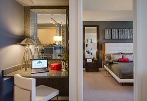 Washington apartment for rent - a bedroom and a living room with a bed and a desk