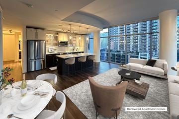 Dallas apartment for rent - A modern living room with a dining table set for two.