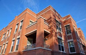 Washington apartment for rent - a red brick building against a blue sky