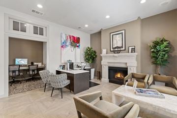 Houston apartment for rent - A living room with a fireplace and a painting on the wall.