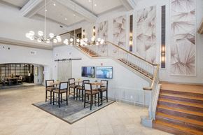 Dallas apartment for rent - a dining room with a table and chairs and a staircase