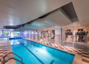 Washington apartment for rent - a swimming pool in a gym with a checkerboard floor and