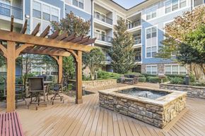 Atlanta apartment for rent - a backyard with a hot tub and a wooden deck