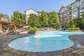Atlanta apartment for rent - a swimming pool with a hotel in the background