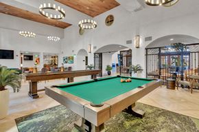 Dallas apartment for rent - a game room with a pool table and a bar