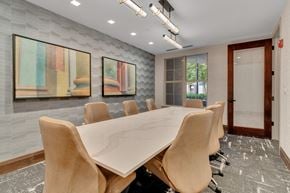 Dallas apartment for rent - a conference room with a large table and chairs