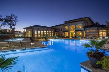 Outdoor pool with expansive deck and in-water tanning ledges