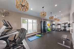 Woodbridge apartment for rent - a gym with treadmills and other exercise equipment at the enclave at university heights
