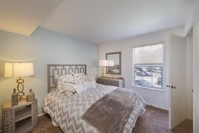 Woodbridge apartment for rent - a bedroom with a bed and a window