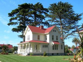 San Francisco apartment for rent - a white house with a red roof next to a tree