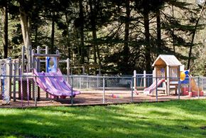 San Francisco triplex for rent - a playground with slides and other toys in a park