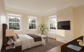 San Francisco triplex for rent - a bedroom with a bed and a tv on the wall