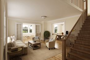 San Francisco triplex for rent - a living room with couches and chairs and a staircase