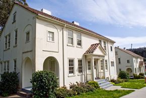 San Francisco triplex for rent - the front of a white house with a sidewalk and grass