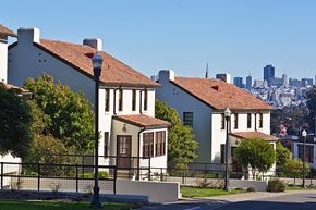 San Francisco triplex for rent - the city in the background of two houses on a hill