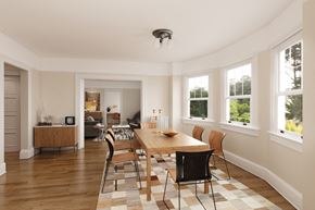 San Francisco triplex for rent - a dining room with a wooden table and chairs