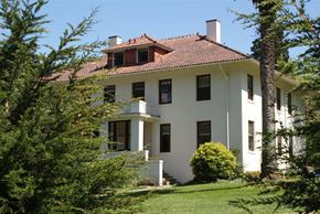 San Francisco triplex for rent - a white house with a red roof and trees