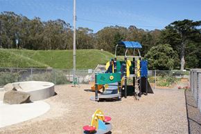 San Francisco townhouse for rent - a playground with a blue and yellow swing set